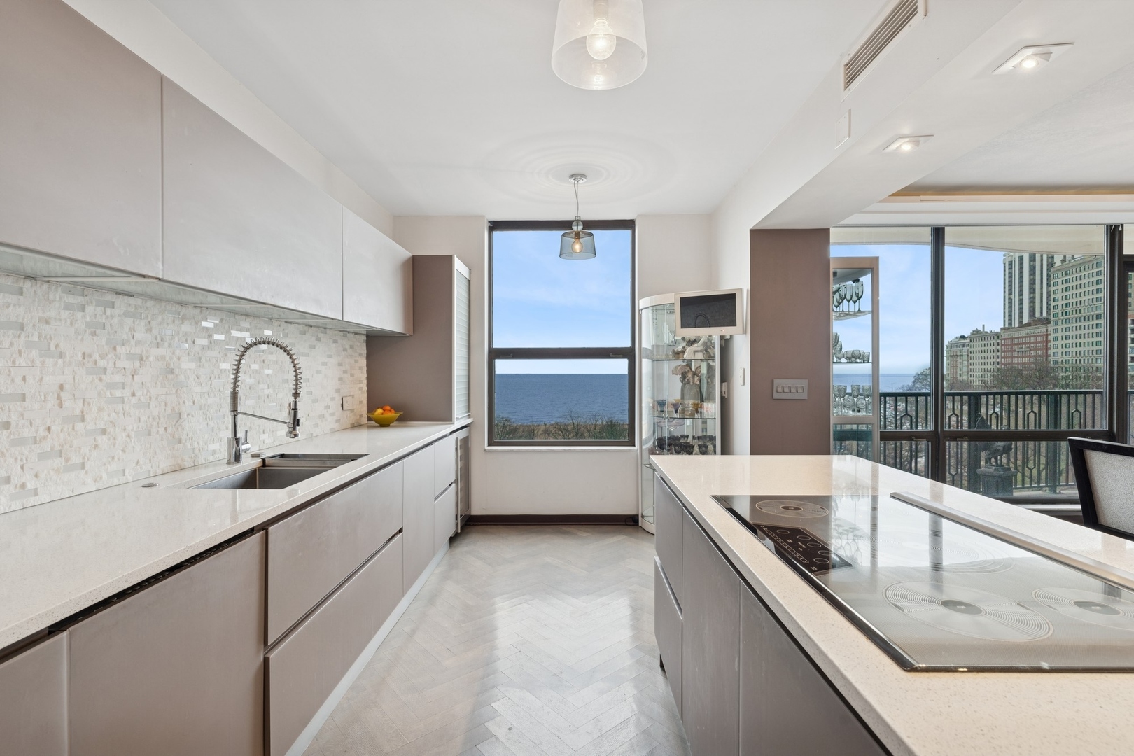 1040 North Lake Shore Drive, Unit 7C Chicago, IL 60611 - Photo 14 of 37 a large white kitchen with a large window