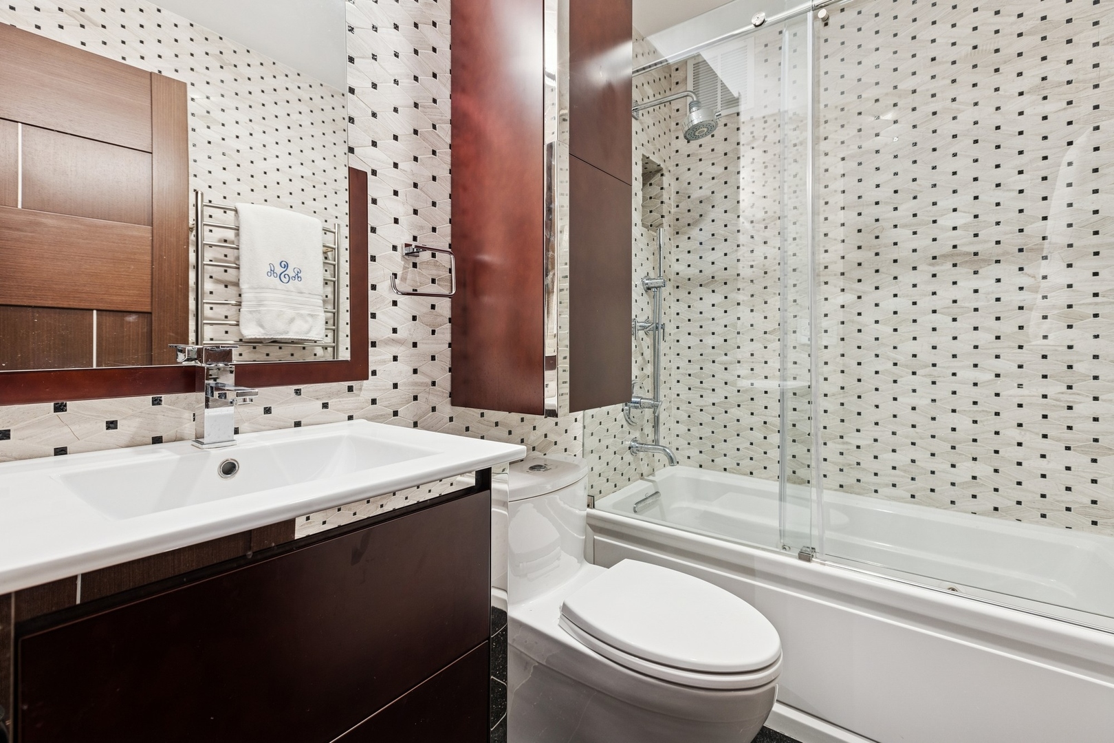 1040 North Lake Shore Drive, Unit 7C Chicago, IL 60611 - Photo 25 of 37 a bathroom with a sink a toilet and shower