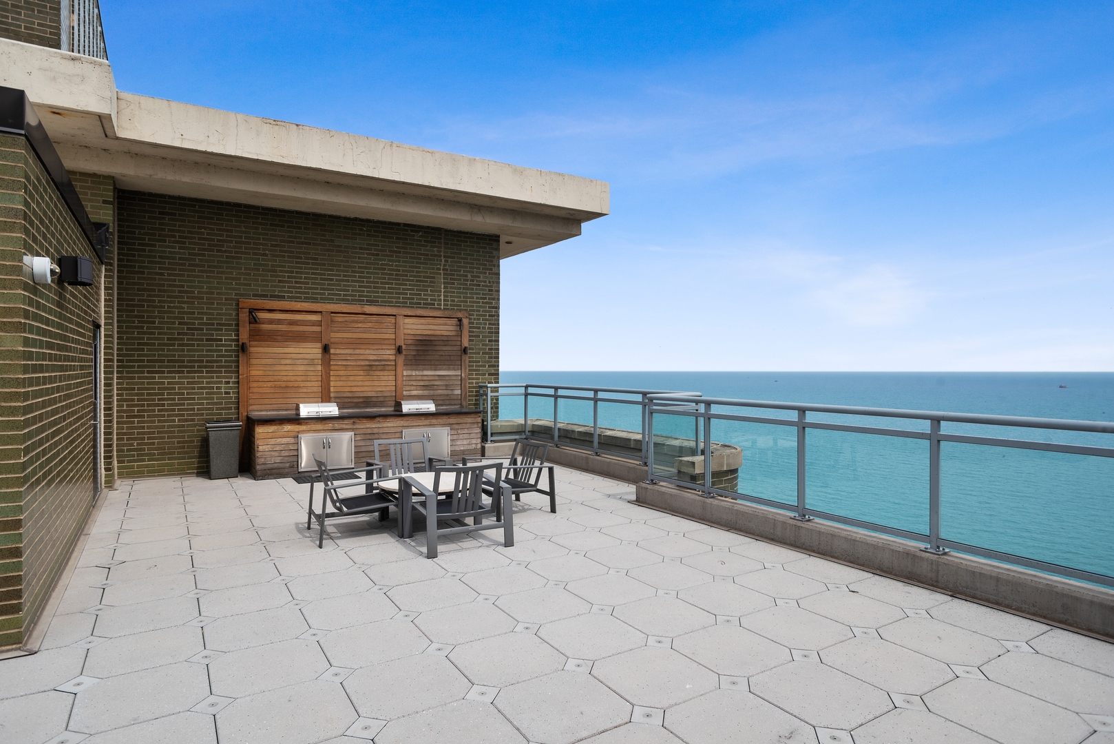 1040 North Lake Shore Drive, Unit 7C Chicago, IL 60611 - Photo 30 of 37 a patio with table and chairs