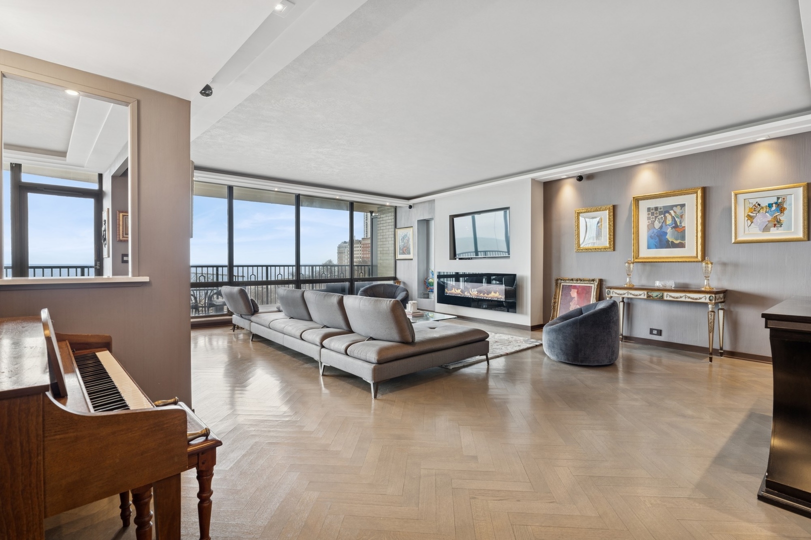 1040 North Lake Shore Drive, Unit 7C Chicago, IL 60611 - Photo 4 of 37 a living room with furniture and large windows