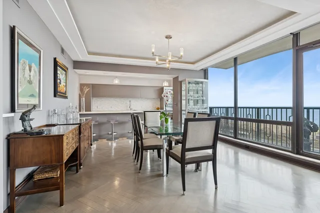 a view of a dining room with furniture window and outside view