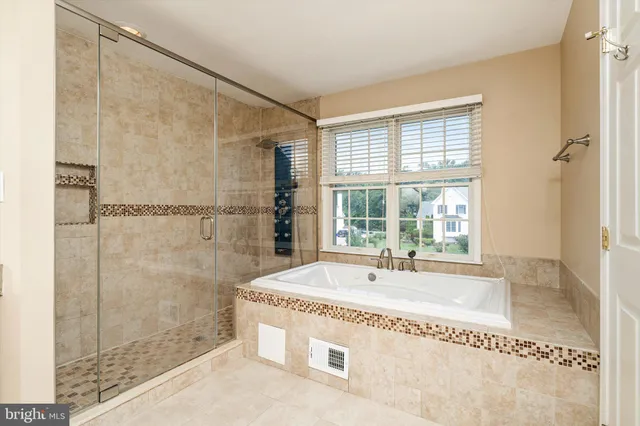 a spacious bathroom with sink and shower