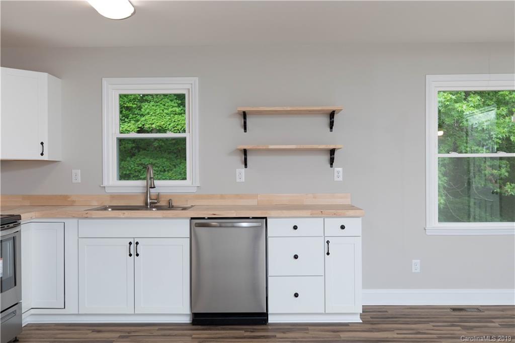 3725 Jenkins Road Blacksburg, SC 29702 - Photo 5 of 21 a kitchen with white cabinets and sink