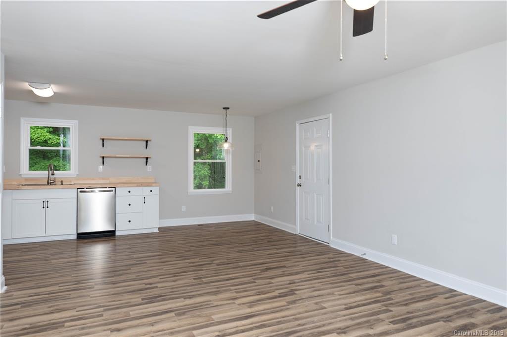 3725 Jenkins Road Blacksburg, SC 29702 - Photo 6 of 21 wooden floor in an empty room with a kitchen