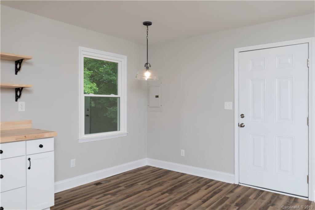3725 Jenkins Road Blacksburg, SC 29702 - Photo 7 of 21 a view of an empty room with wooden floor and a window