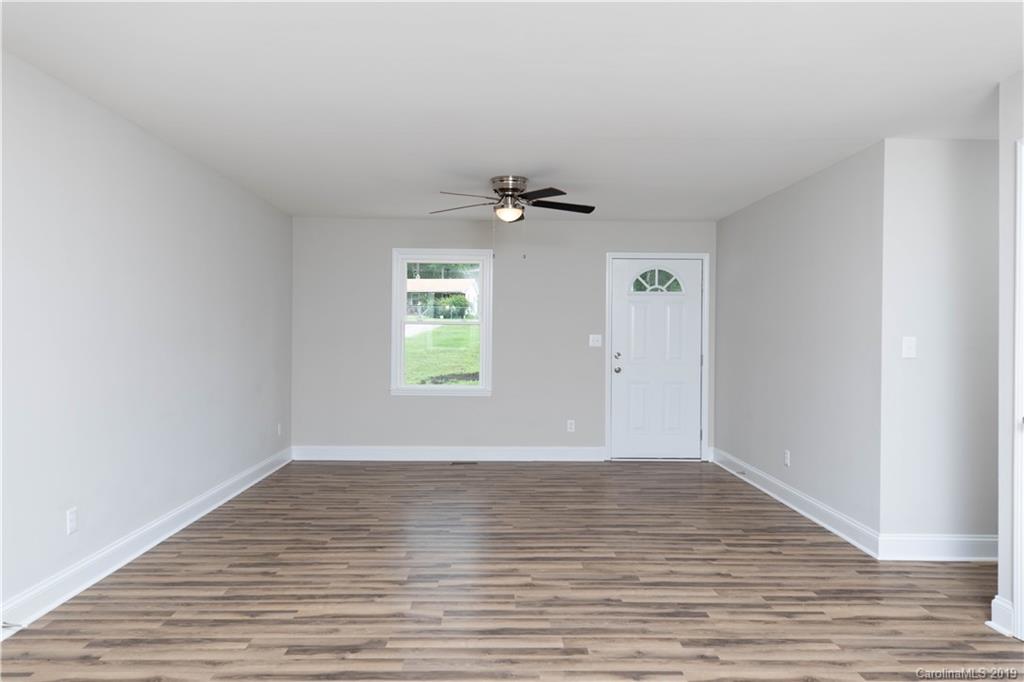 3725 Jenkins Road Blacksburg, SC 29702 - Photo 8 of 21 wooden floor in an empty room with a window