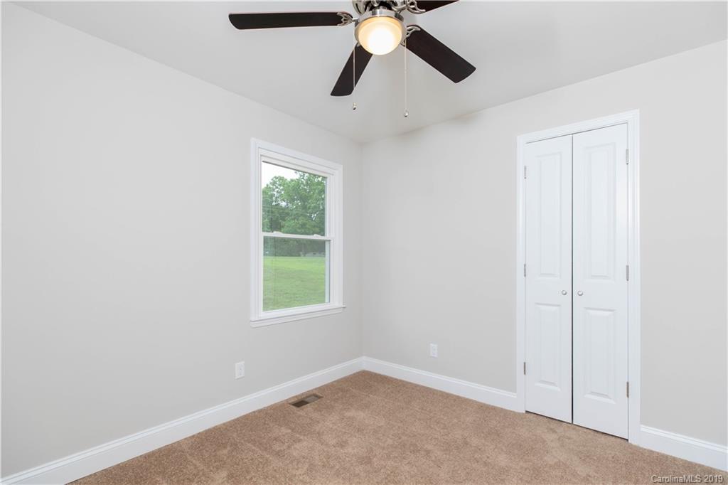 3725 Jenkins Road Blacksburg, SC 29702 - Photo 9 of 21 an empty room with windows and fan