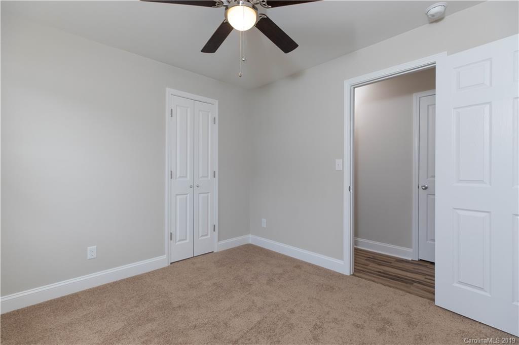 3725 Jenkins Road Blacksburg, SC 29702 - Photo 10 of 21 an empty room with a chandelier fan