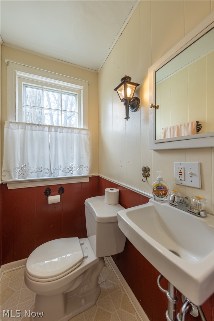 1050 Renfield Road Cleveland Heights, OH 44121 - Photo 14 of 41 Bathroom with toilet, ornamental molding, tile floors, and sink