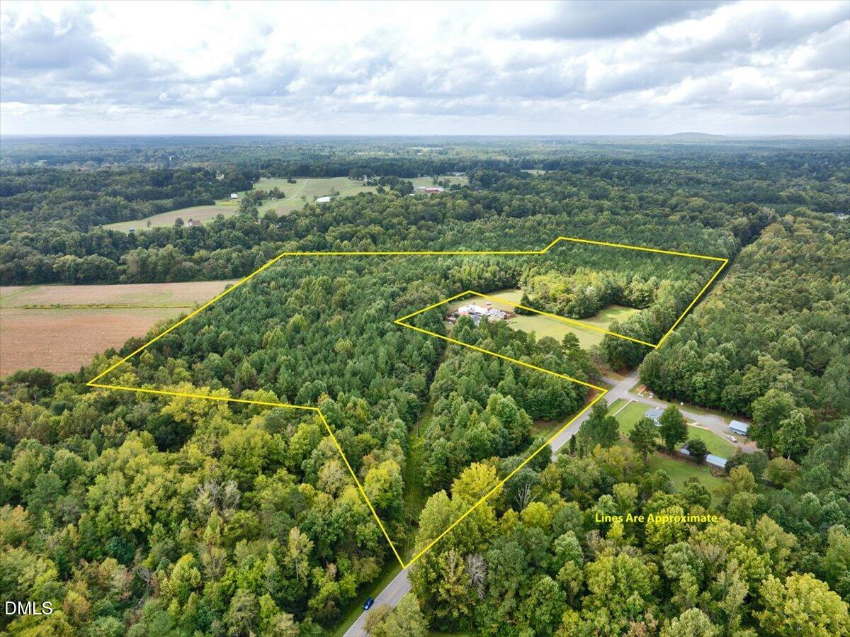 2024 Enon Road Oxford, NC 27565 - Photo 5 of 5 a view of a city with lush green forest