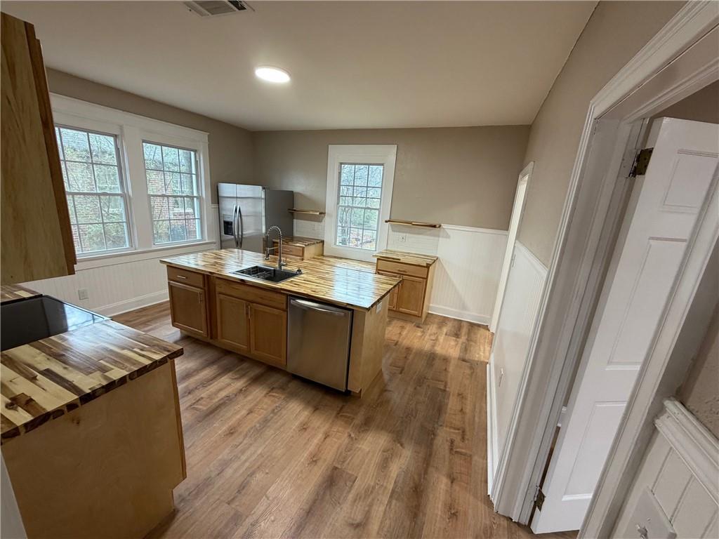 696 Goodyear Avenue Rockmart, GA 30153 - Photo 3 of 9 a living room with stainless steel appliances granite countertop furniture wooden floor and a window