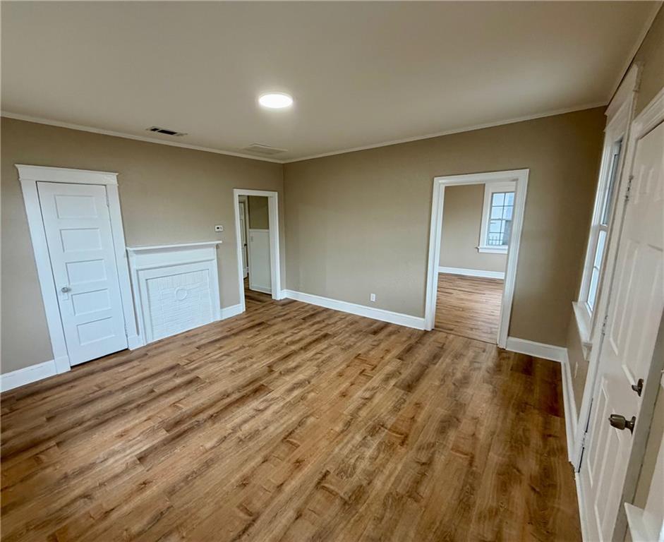 696 Goodyear Avenue Rockmart, GA 30153 - Photo 6 of 9 a bedroom with a bed and wooden floor