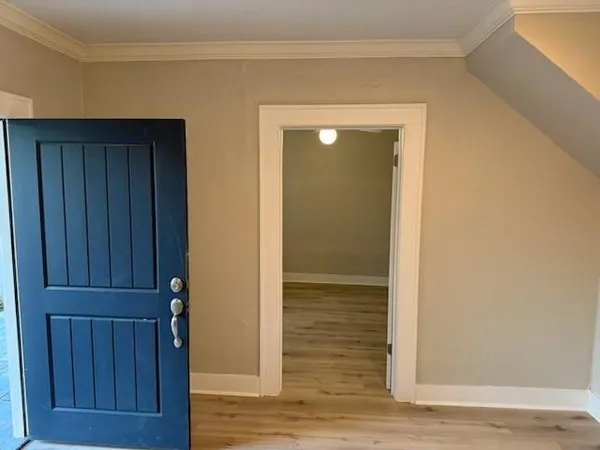 a kitchen with kitchen island granite countertop a sink and stainless steel appliances