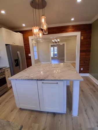 a living room with a fireplace and a window