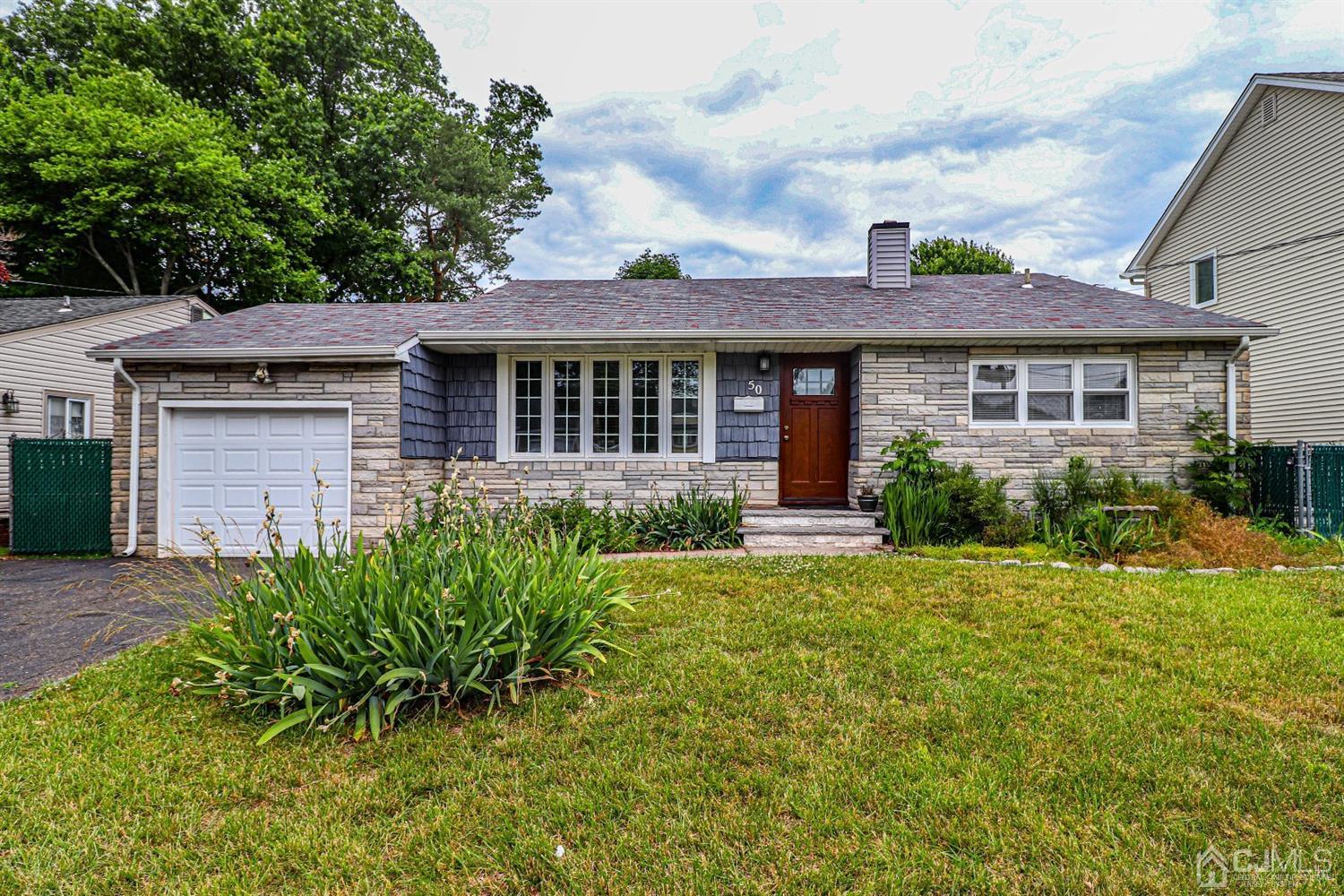 50 Albemarle Road Colonia, NJ 07067 - Photo 1 of 22 front view of a house with a yard
