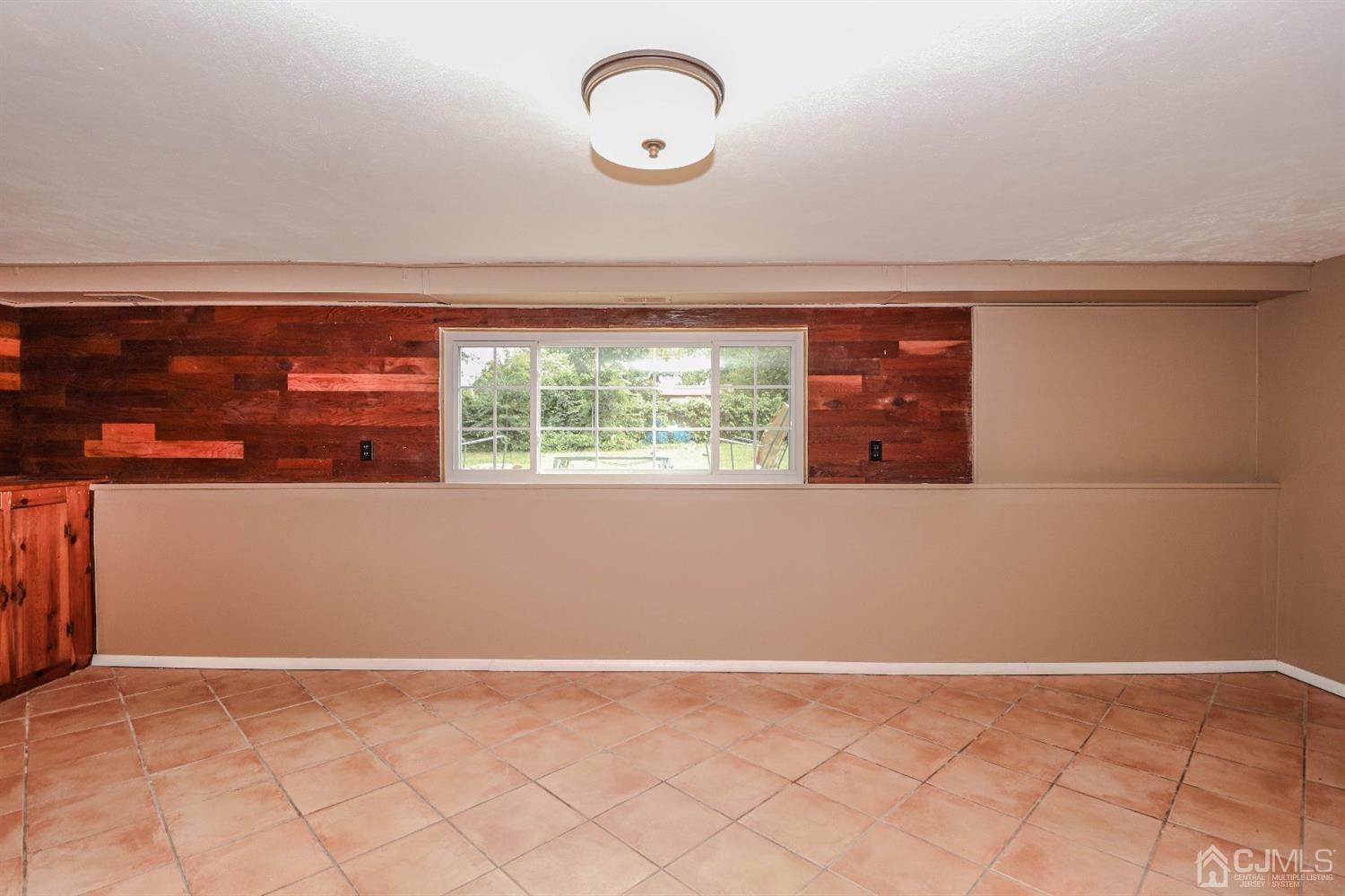 50 Albemarle Road Colonia, NJ 07067 - Photo 15 of 22 a view of a room with wooden floor and window