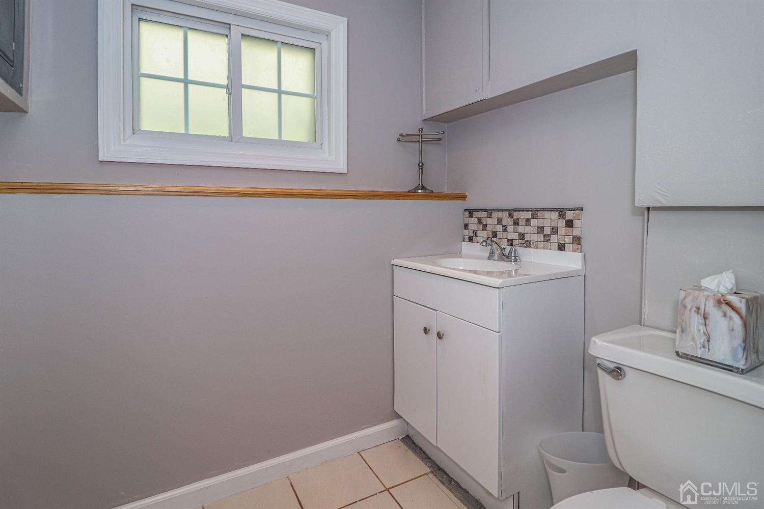 50 Albemarle Road Colonia, NJ 07067 - Photo 18 of 22 a bathroom with a sink toilet and window