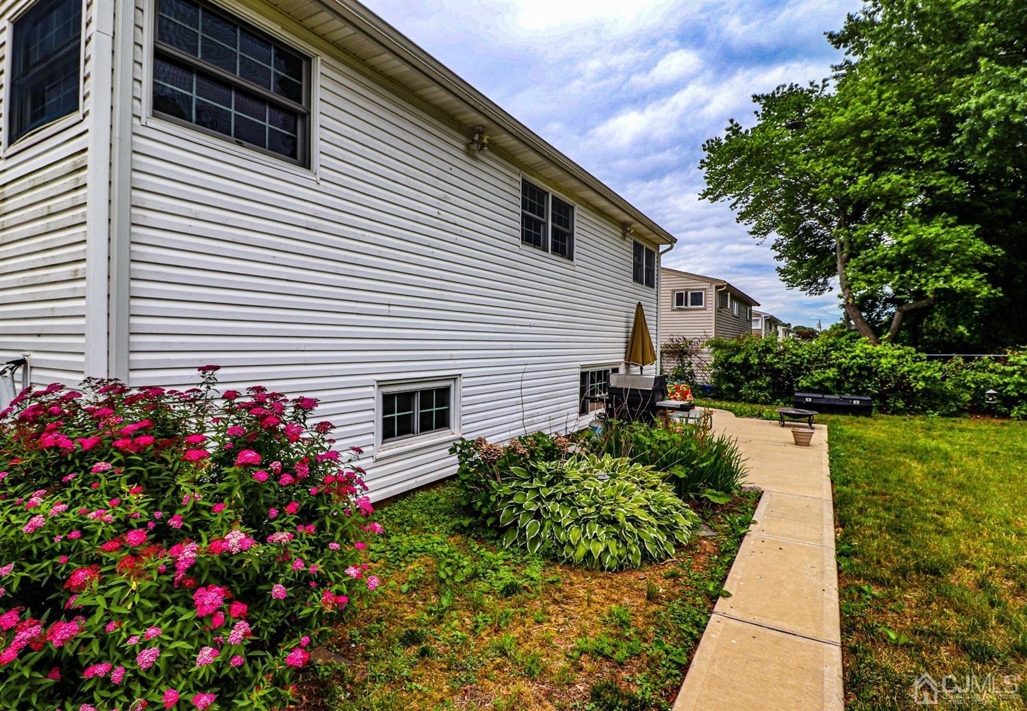 50 Albemarle Road Colonia, NJ 07067 - Photo 19 of 22 a front view of a house with a garden