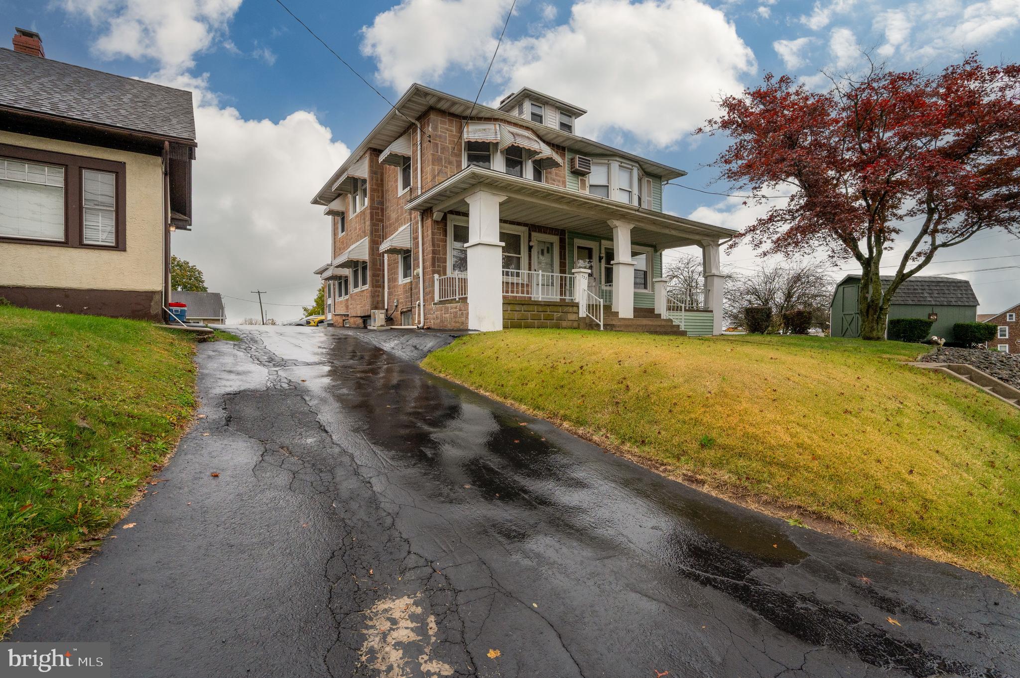 a view of a house with pool and yard