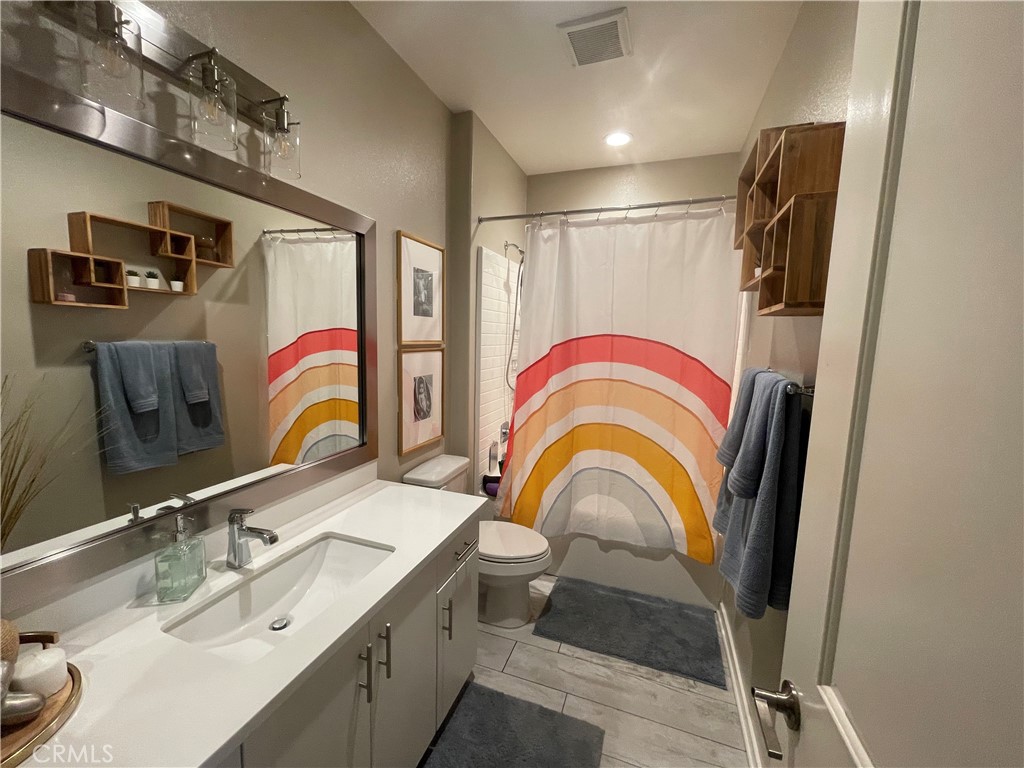 768 Central Upland, CA 91786 - Photo 12 of 15 a bathroom with a sink vanity granite and a mirror
