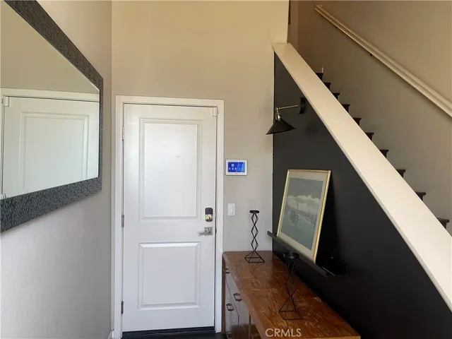 a view of closet with wooden floor