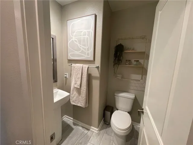 a bathroom with a toilet and a sink