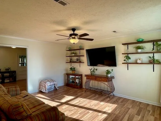 a bedroom with a bed and flat screen tv