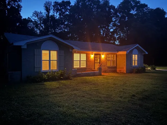 a view of yard with patio