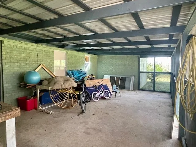 a bedroom with furniture and a flat screen tv