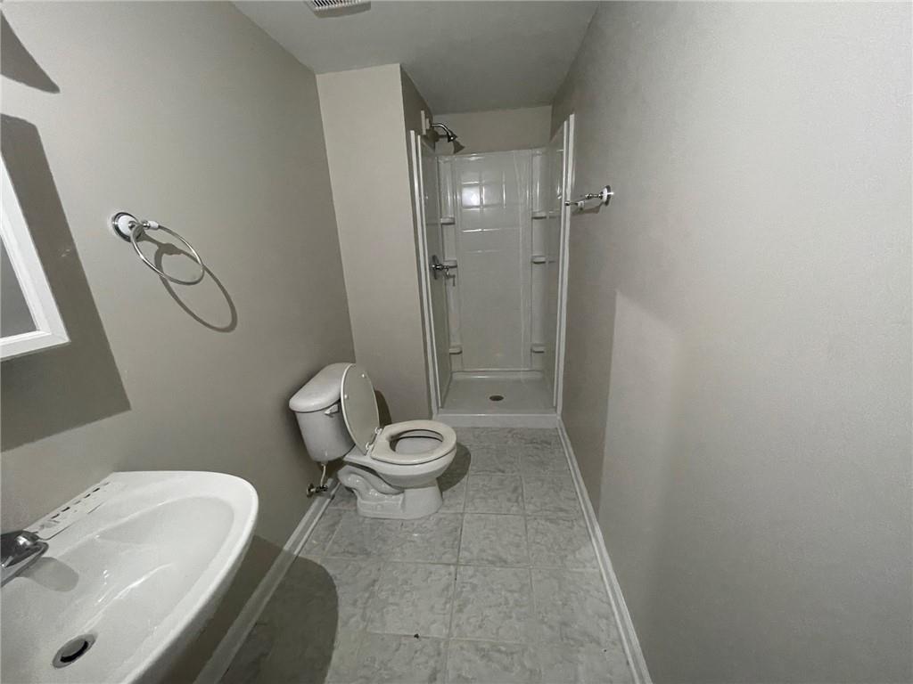 95 Luke Drive Dallas, GA 30132 - Photo 14 of 15 a bathroom with a granite countertop toilet and a sink