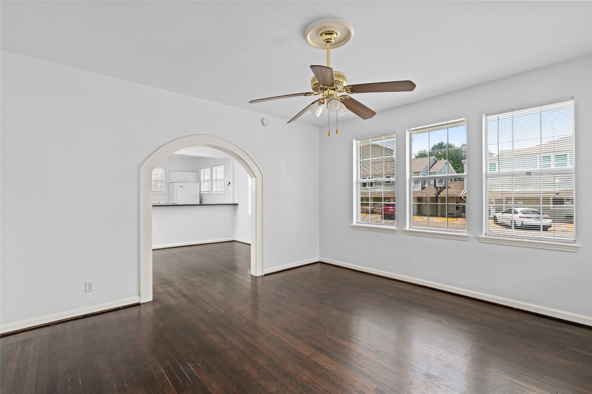 2402 Hazard Street Houston, TX 77019 - Photo 12 of 41 wooden floor in an empty room with a window