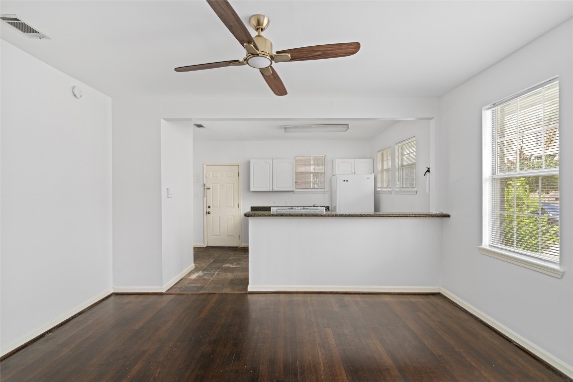 2402 Hazard Street Houston, TX 77019 - Photo 13 of 41 a view of a kitchen with wooden floor and a window