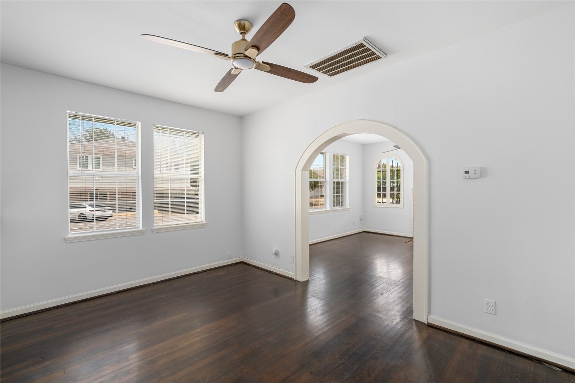 2402 Hazard Street Houston, TX 77019 - Photo 14 of 41 an empty room with wooden floor fan and windows