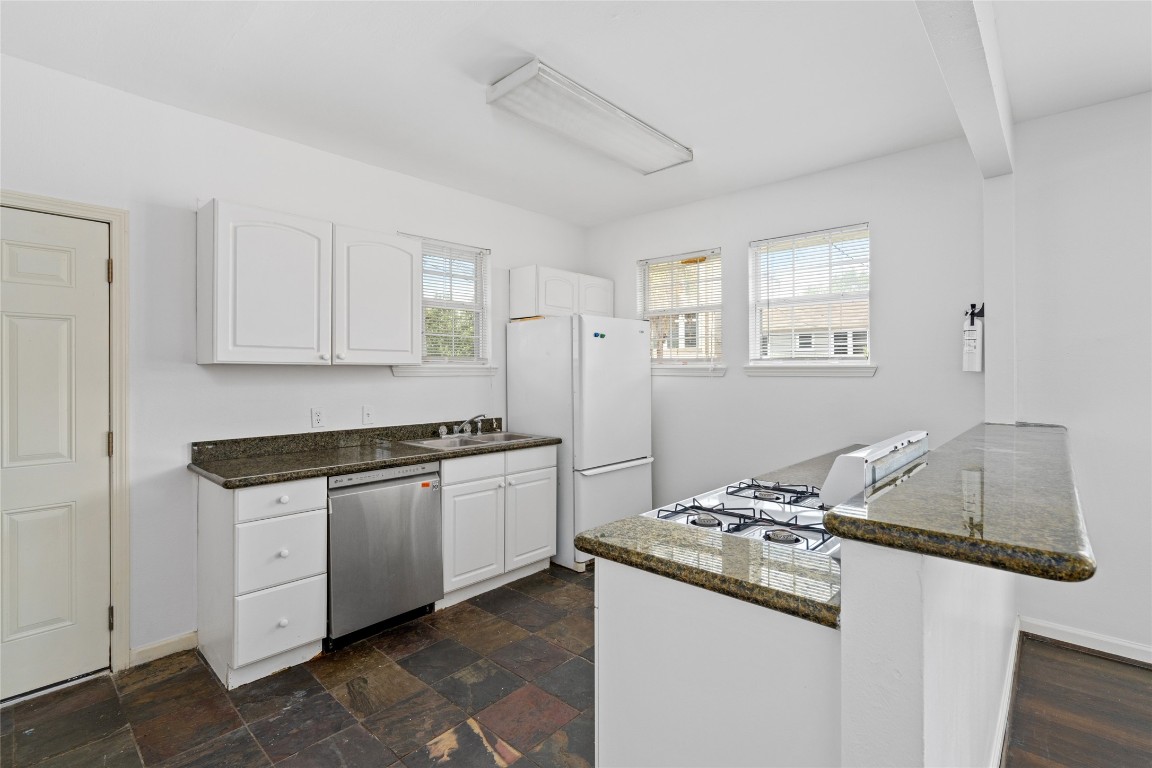 2402 Hazard Street Houston, TX 77019 - Photo 15 of 41 a kitchen with stainless steel appliances granite countertop a sink and a stove