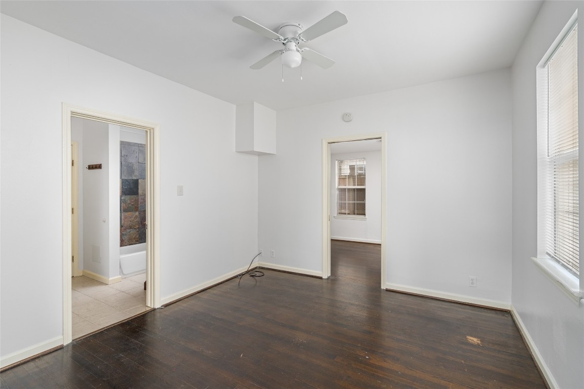 2402 Hazard Street Houston, TX 77019 - Photo 18 of 41 an empty room with wooden floor and windows