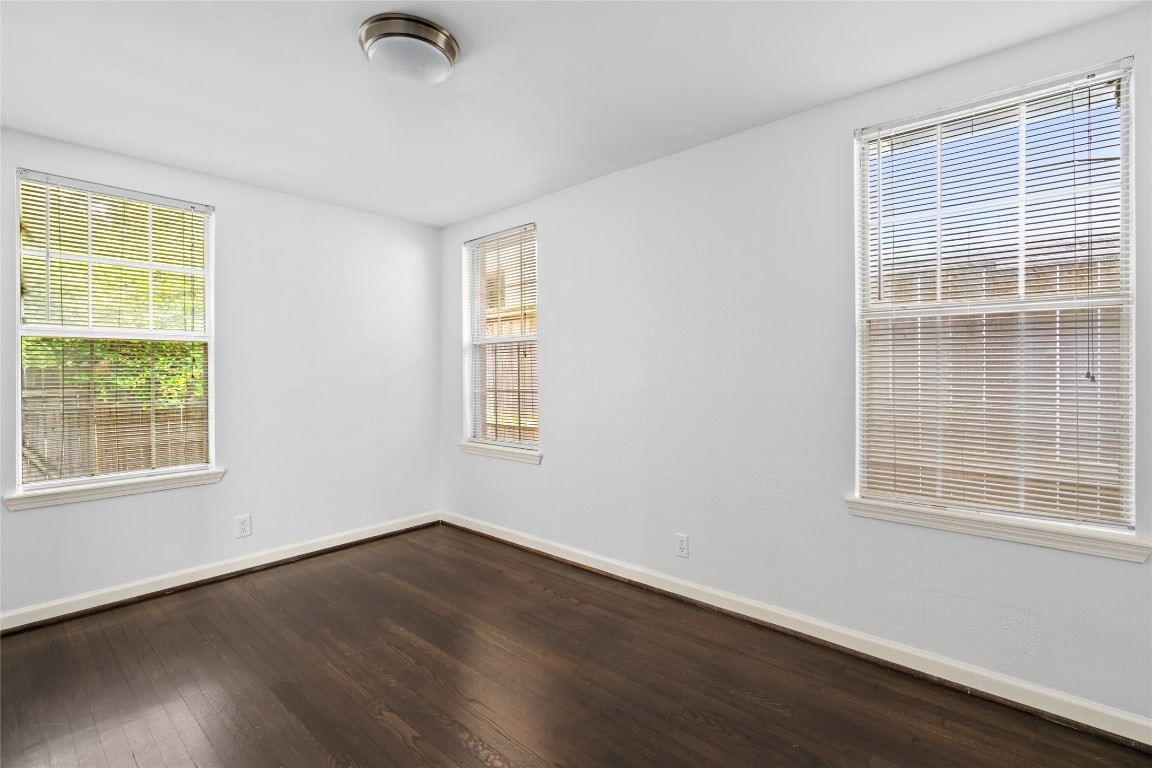 2402 Hazard Street Houston, TX 77019 - Photo 20 of 41 an empty room with wooden floor and windows
