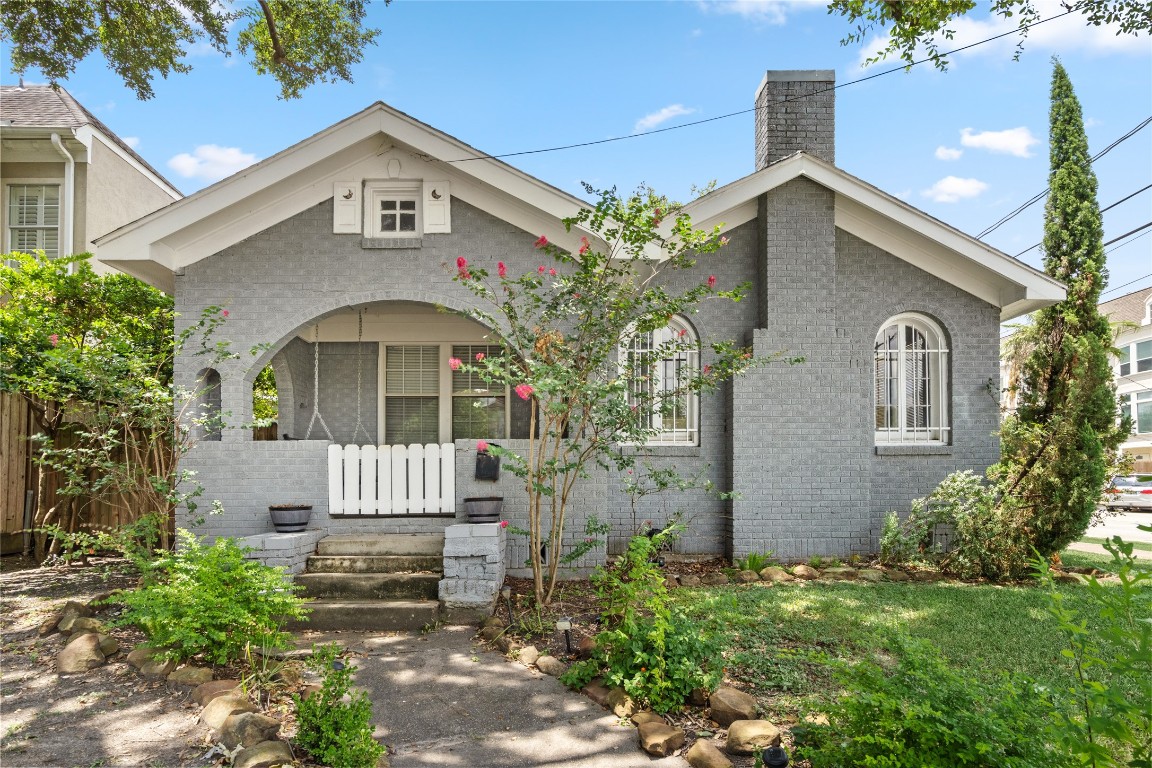 2402 Hazard Street Houston, TX 77019 - Photo 2 of 41 front view of house with a garden