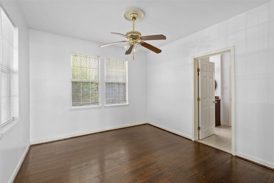 2402 Hazard Street Houston, TX 77019 - Photo 23 of 41 an empty room with windows and fan