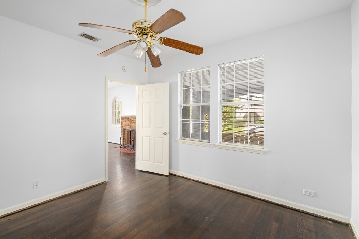 2402 Hazard Street Houston, TX 77019 - Photo 24 of 41 an empty room with wooden floor closet and windows