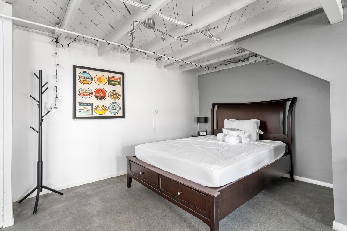 2402 Hazard Street Houston, TX 77019 - Photo 28 of 41 a bed sitting in a bedroom next to a bathroom
