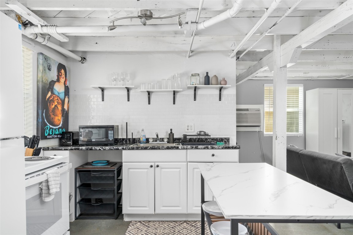 2402 Hazard Street Houston, TX 77019 - Photo 29 of 41 a kitchen with a stove a refrigerator and a sink