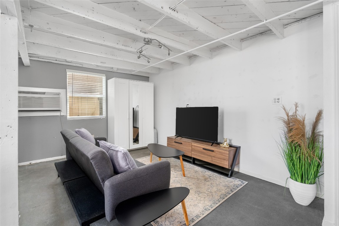 2402 Hazard Street Houston, TX 77019 - Photo 32 of 41 a living room with furniture and a flat screen tv