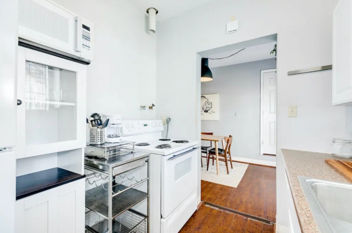 2402 Hazard Street Houston, TX 77019 - Photo 39 of 41 a view of a dining room with furniture and wooden floor