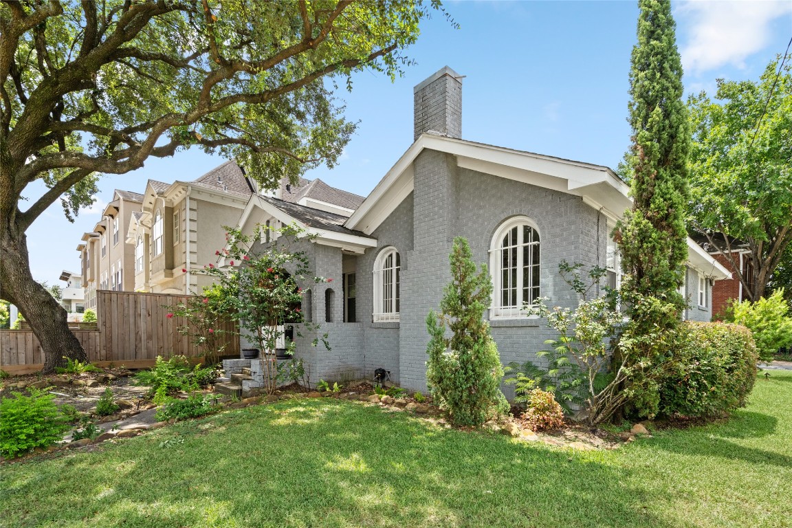 2402 Hazard Street Houston, TX 77019 - Photo 5 of 41 a front view of a house with a garden