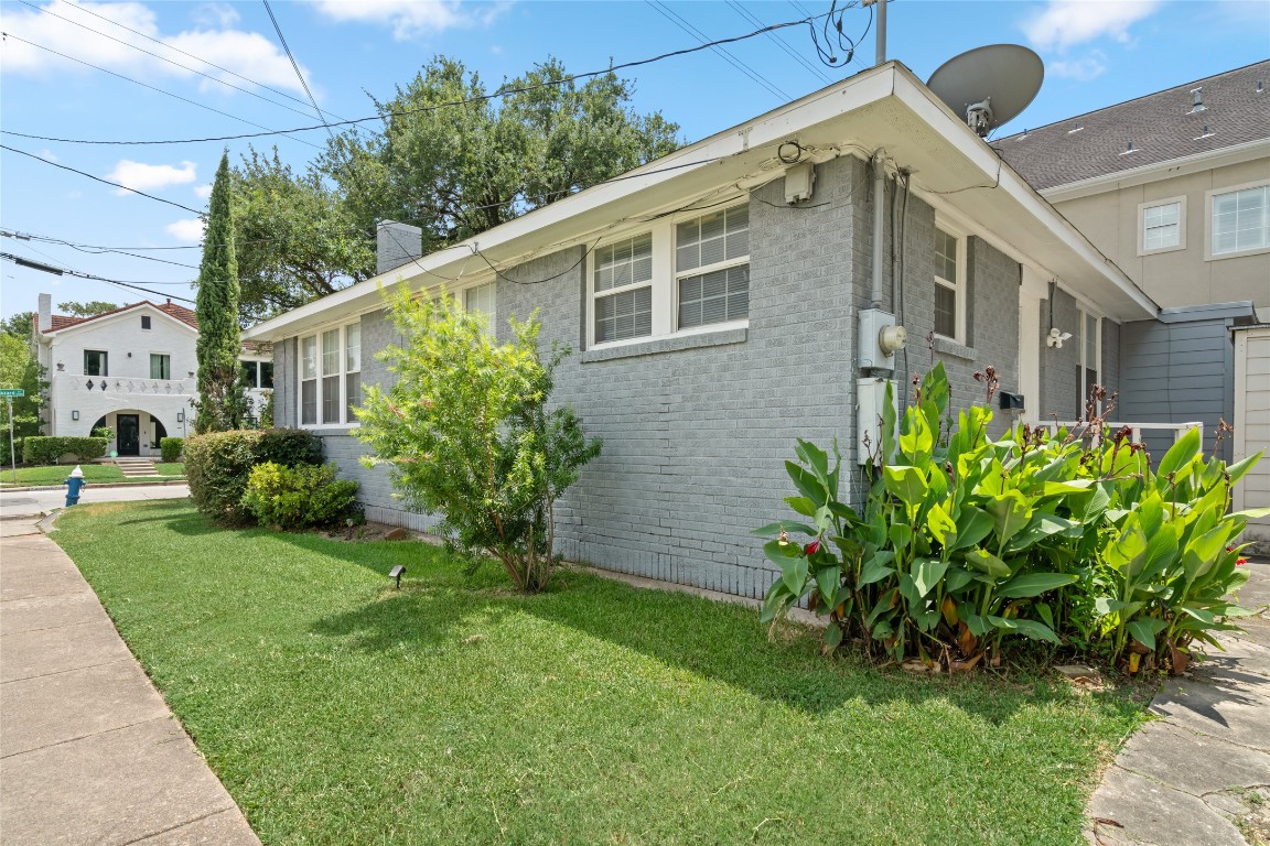 2402 Hazard Street Houston, TX 77019 - Photo 6 of 41 a front view of a house with a garden