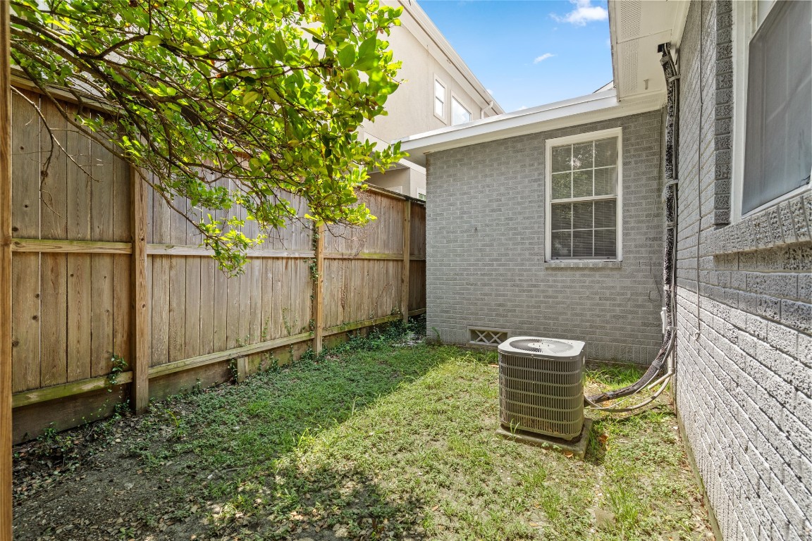 2402 Hazard Street Houston, TX 77019 - Photo 7 of 41 a backyard of a house with table and chairs