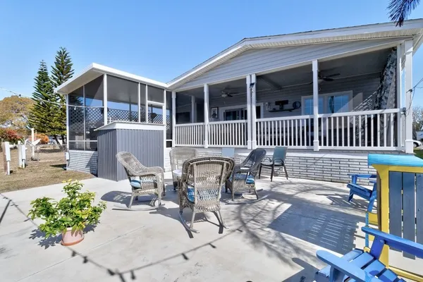 a view of house with outdoor seating space