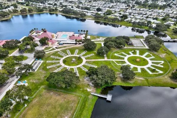 an aerial view of a house with a lake view