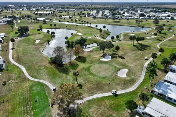 an aerial view of a house with a lake view
