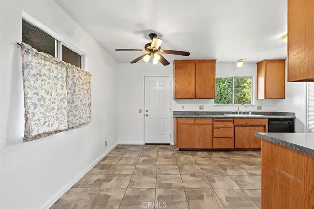 a kitchen with a stove a sink and a refrigerator